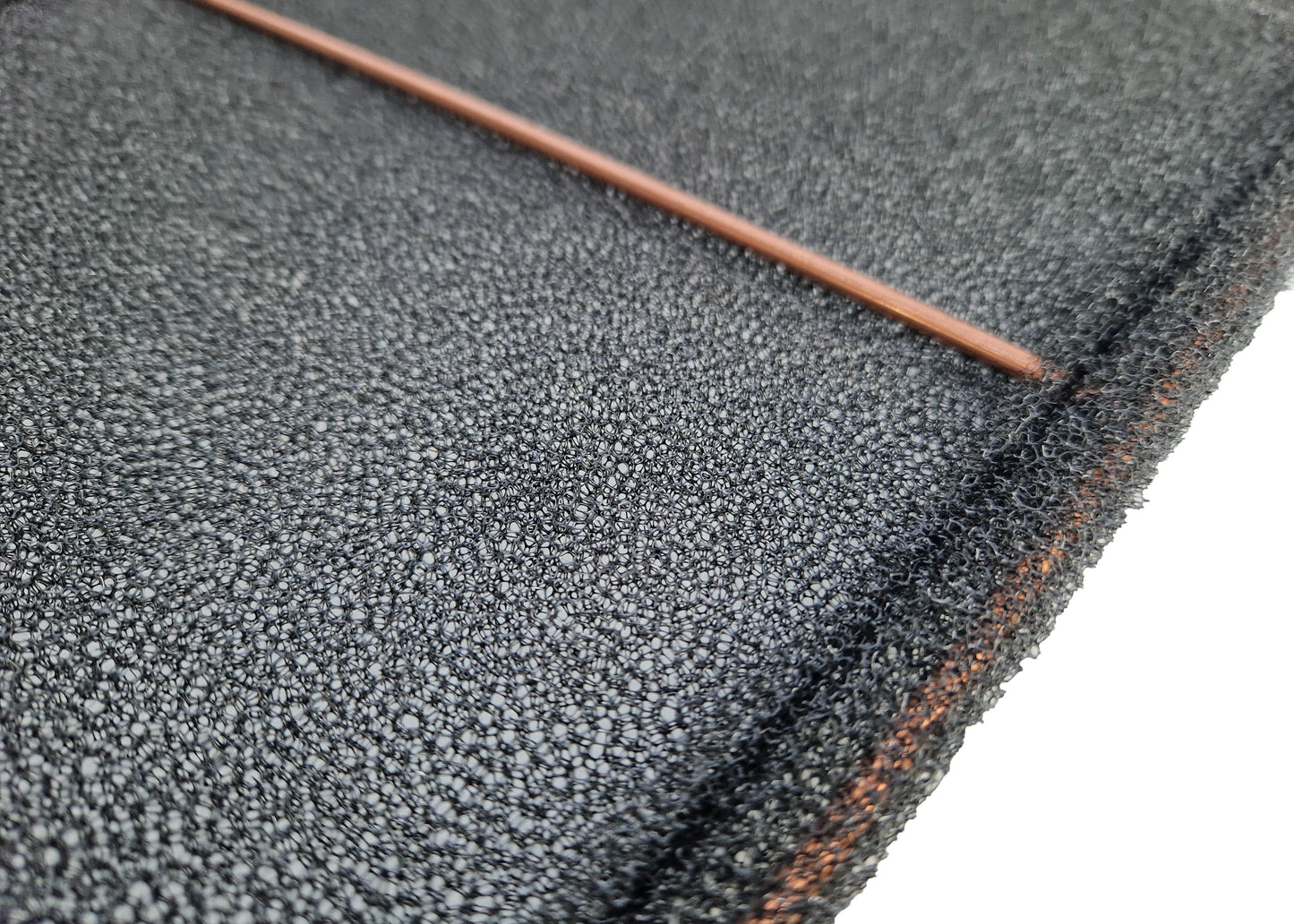 photo showing a close-up of the reverse side of the washable air conditioning filters the metal frame can be easily seen.