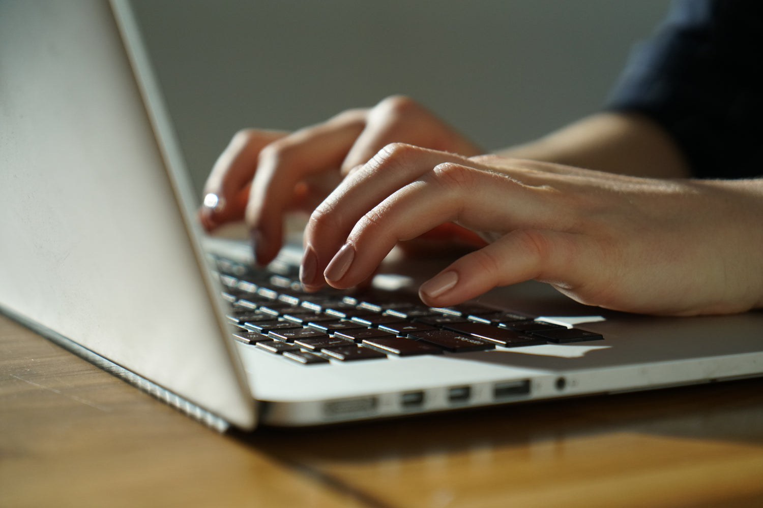 photo showing a person typing which is used as an illustration on our contact us page
