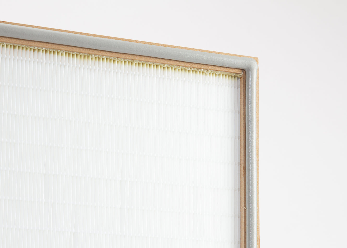 A close-up of a HEPA laminar flow filter with a wooden frame.